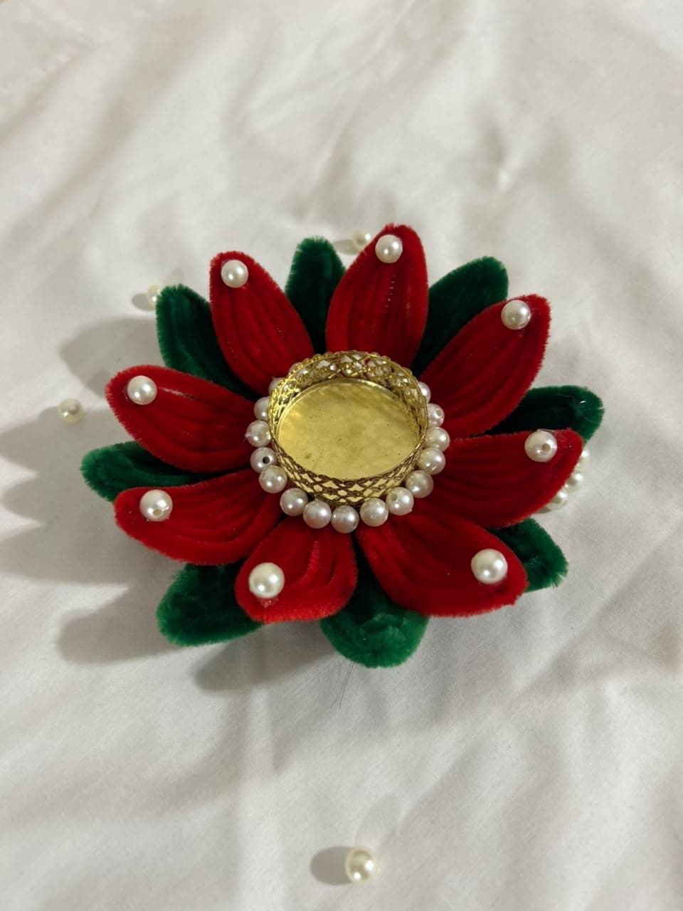 Beautiful handmade lotus-shaped diya holder crafted from colorful pipe cleaners.