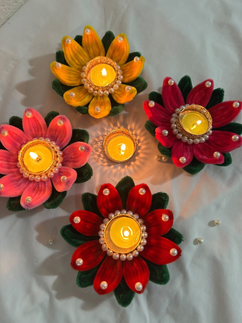 Beautiful handmade lotus-shaped diya holder crafted from colorful pipe cleaners