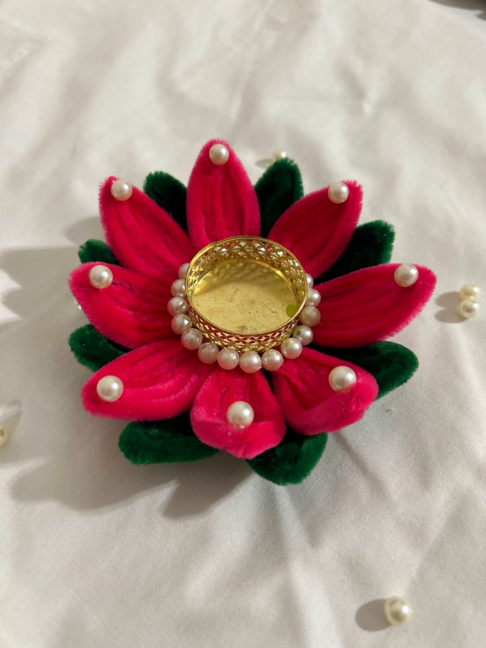 Beautiful handmade lotus-shaped diya holder crafted from colorful pipe cleaners.